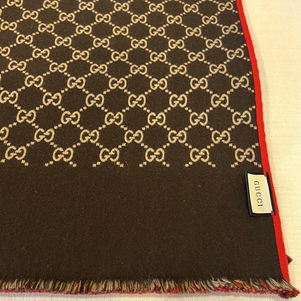 Authentic Gucci Scarf NWOT, in box. Unisex wool/silk reversible logo scarf